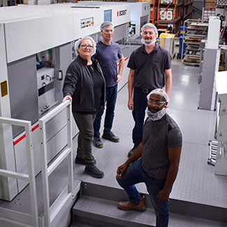 Jones Healthcare team beside newly installed NOVACUT 106 ER